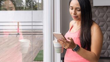 Pregnant woman looking at cell phone