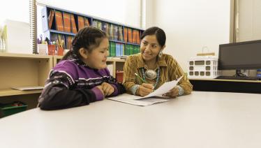 Navajo teacher and student work together on Navajo reservation
