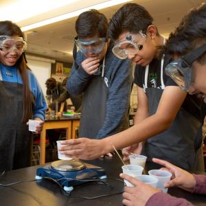 Students do science experiment together